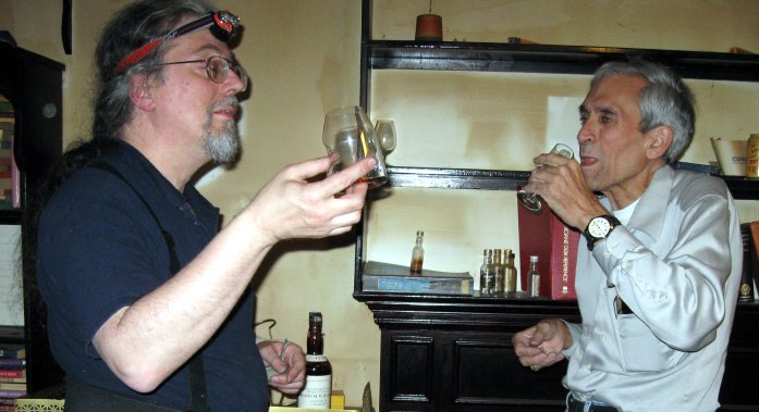 Bill (left) and Russ toasting MAP and Floyd with MOHM (rear) while packing up Mike's bungalow.
